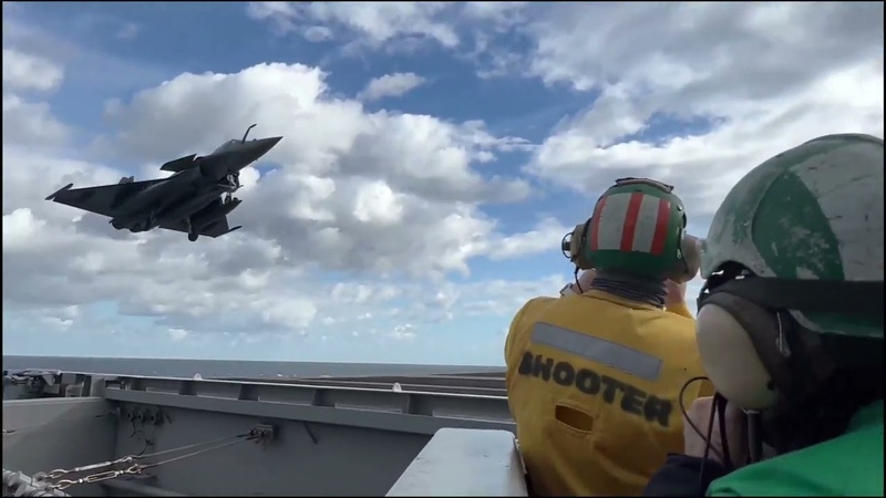 French Rafale fighter jets operate with USS George H. W. Bush ( CVN 77) Multicarrier