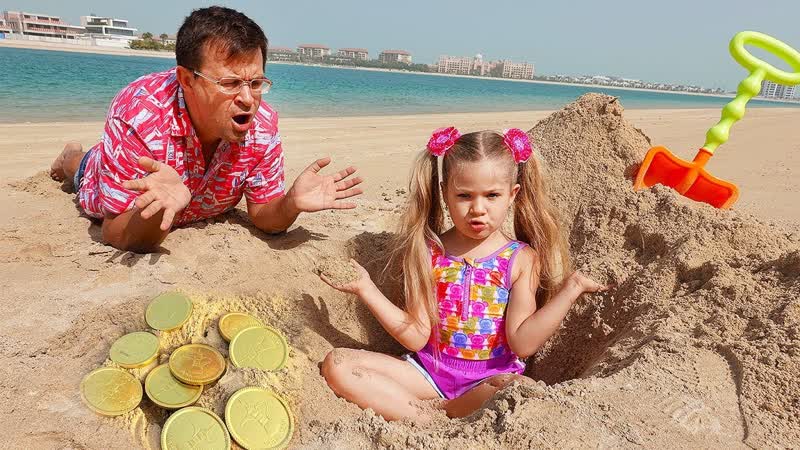 Diana and Roma on the beach Playing with Sand and other Kids