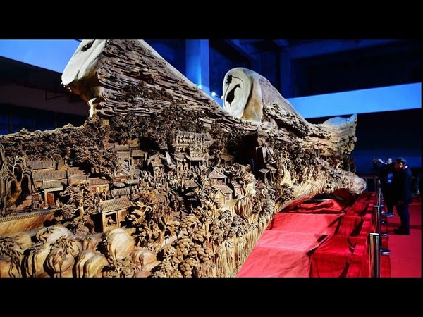 Chinese woodcarving master creates giant artwork from a single timber, CCTV