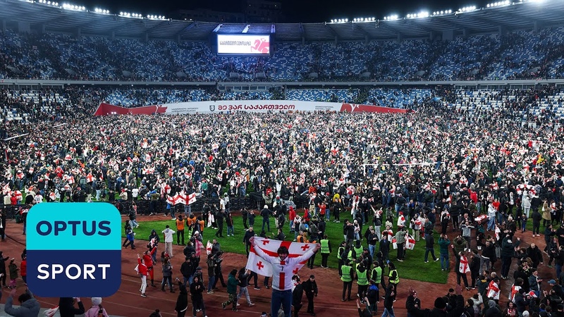 SCENES: Georgia fans storm pitch after qualifying for first tournament and knocking out
